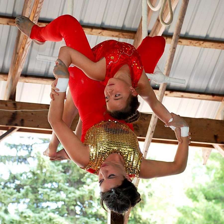 camper and staff doing aerial circus tricks