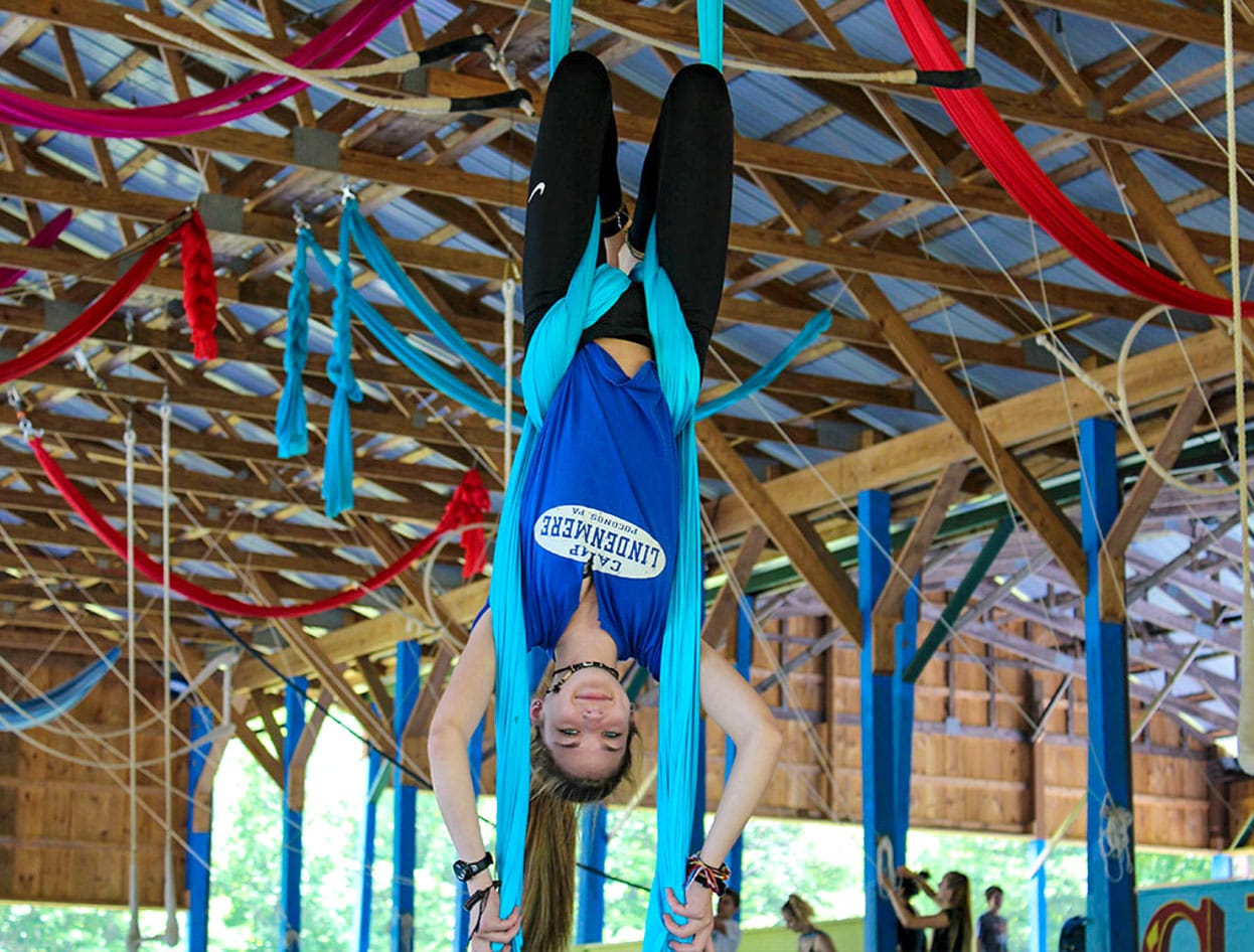 girl camper doing aerial acrobatics