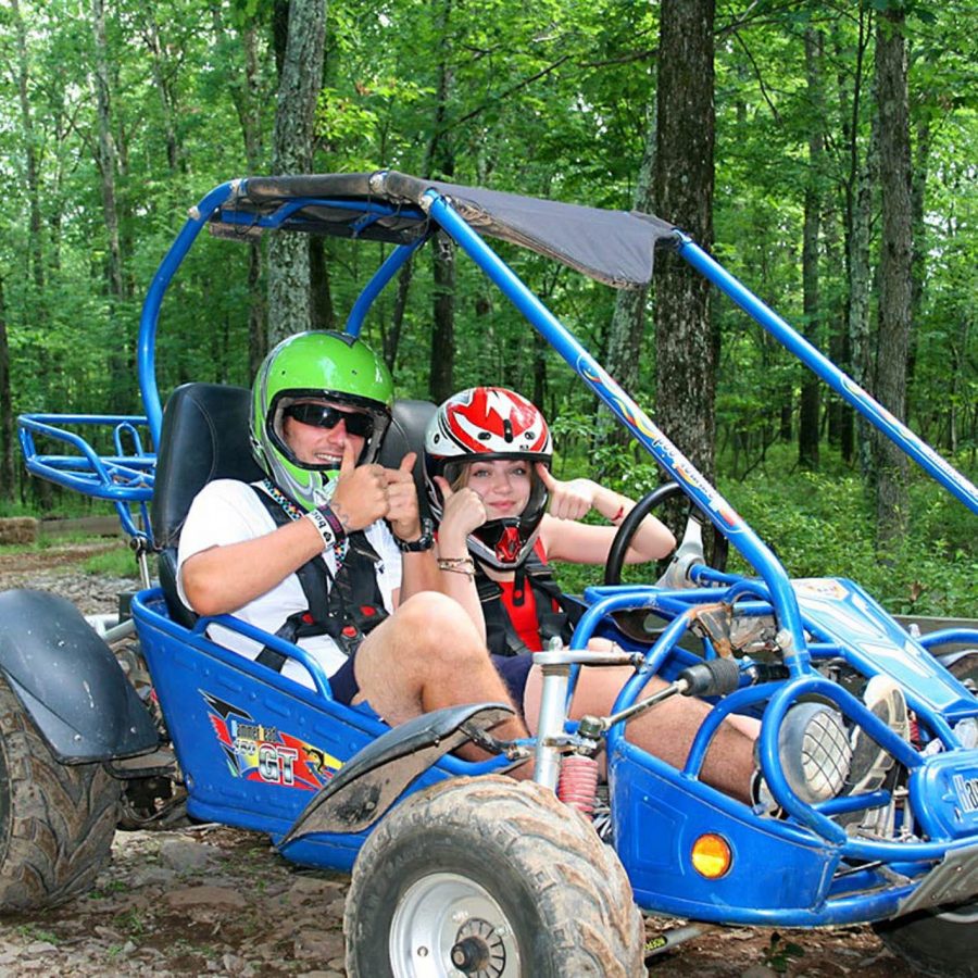Campers in go karts giving thumbs up