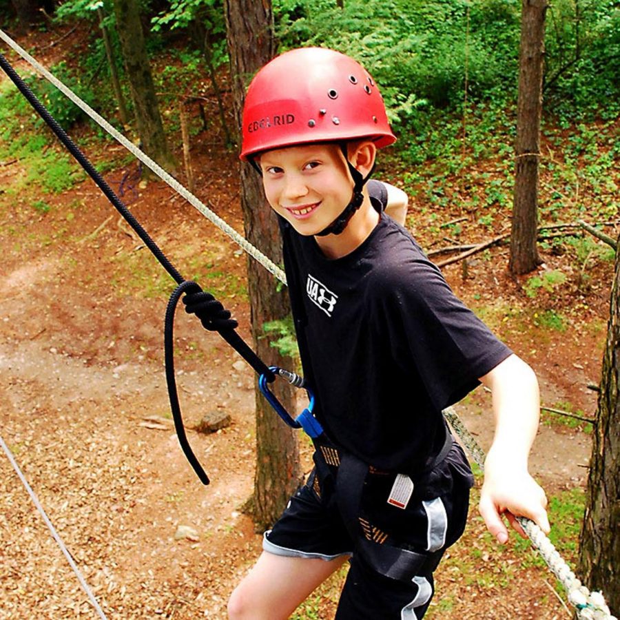 Camper on high ropes course