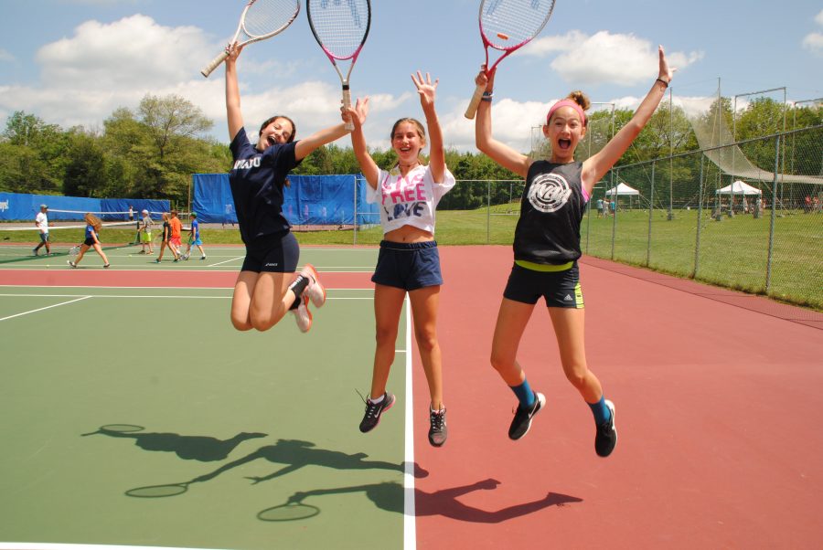 Tennis players jumping on the court.